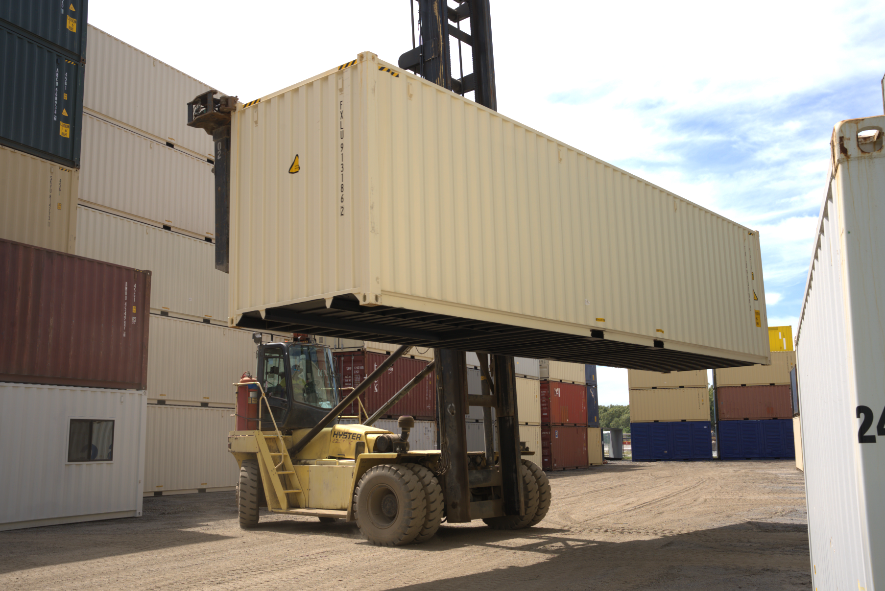 40ft shipping container being held by a forklift