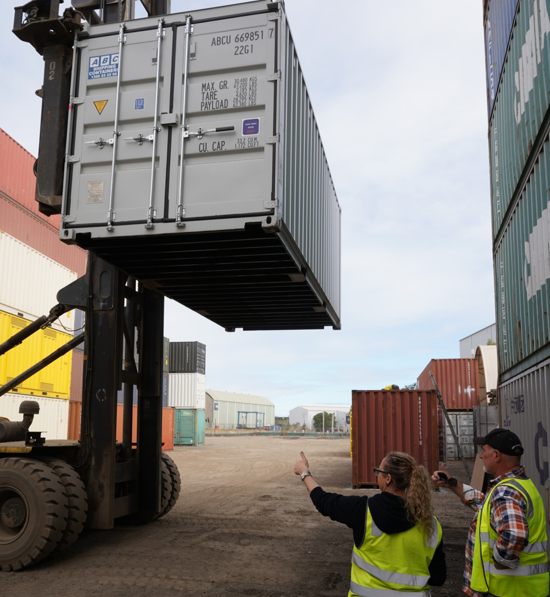 20ft shipping container being inspected from the bottom
